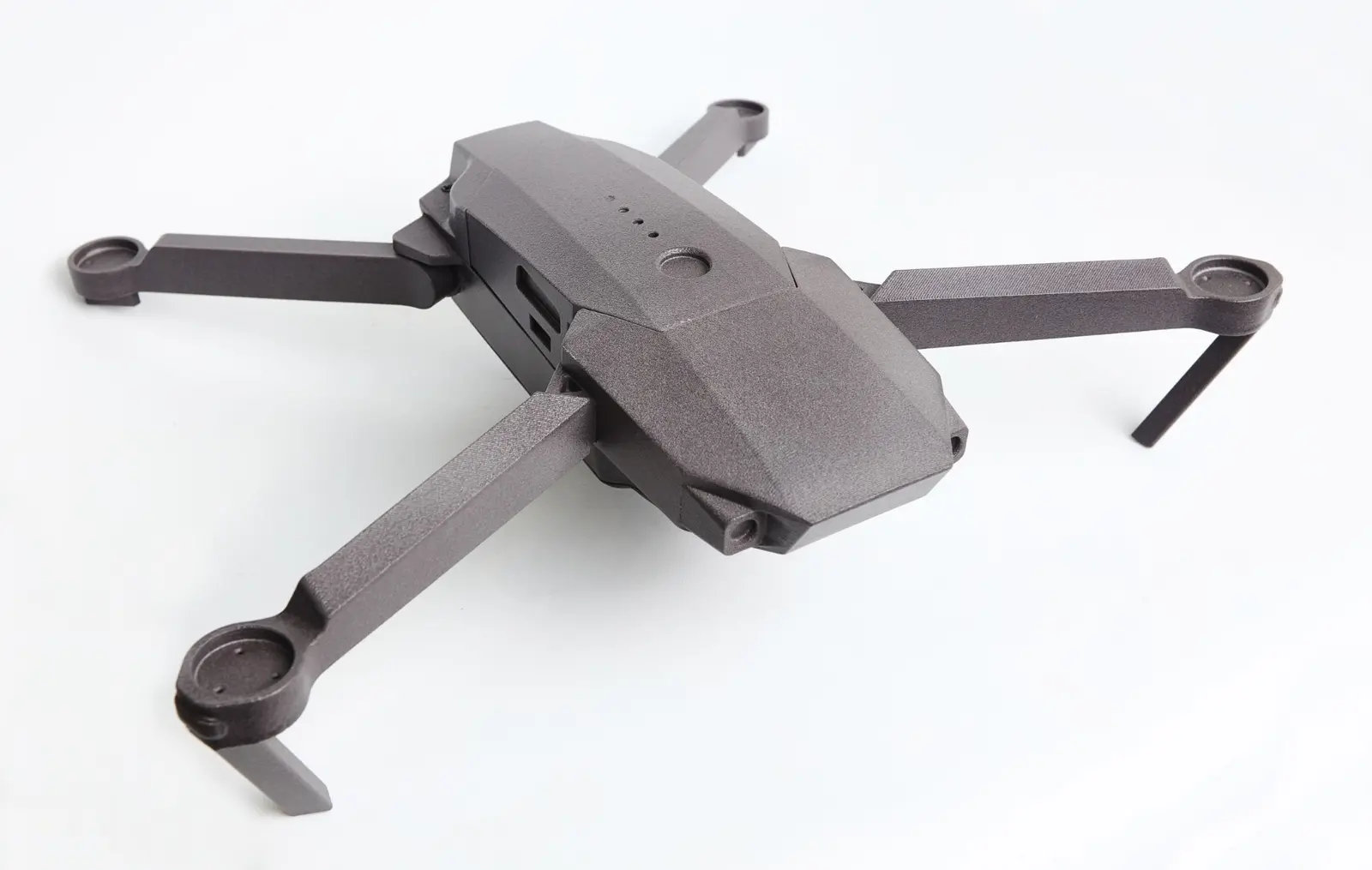 Unmanned aerial vehicle body with folding arms