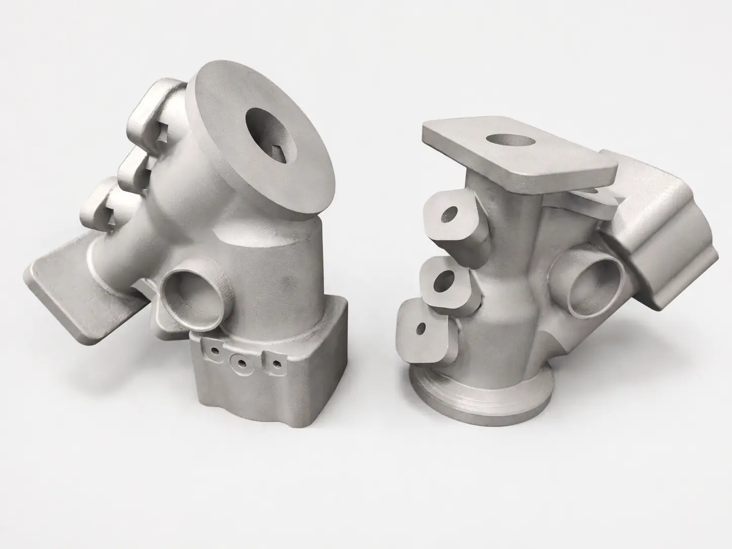 Two complex metal housing components for mechanical engineering